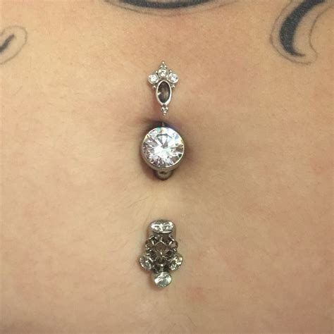 multiple belly button piercings|More.